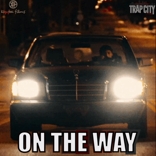 A Poster For Trap City Shows A Car Driving Down The Street GIF