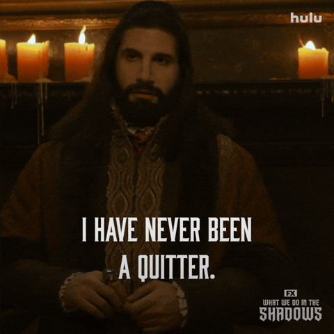 A Poster For What We Do In The Shadows Shows A Man Holding A Book GIF