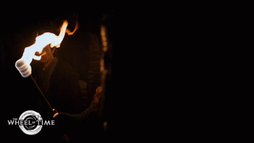 A Poster For Wheel Of Time Shows A Group Of People Walking Through A Dark Tunnel GIF