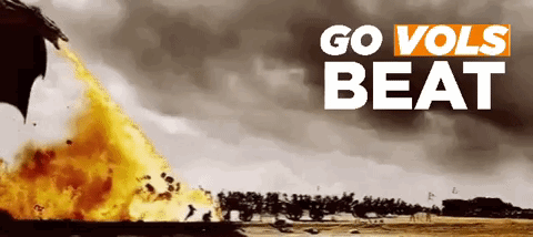 A Poster That Says Go Vols Beat With A Fire Coming Out Of A Dragon 'S Mouth GIF