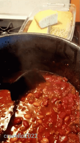 A Pot Of Chili Is Being Stirred By A Black Spoon And The Photo Was Taken By Cravello222 GIF