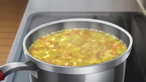 a pot of soup is cooking on a stove with steam coming out of it