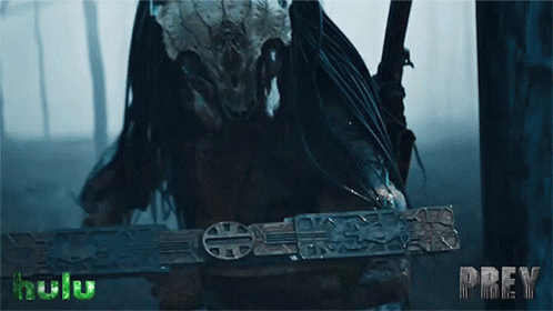 A Predator Is Holding A Sword With The Word Prey On The Bottom GIF