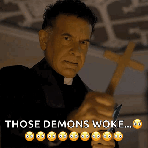 A Priest Holding A Cross And A Knife With The Words Those Demons Woke Below Him GIF