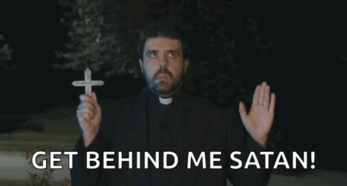 A Priest Holding A Cross With The Words Get Behind Me Satan GIF