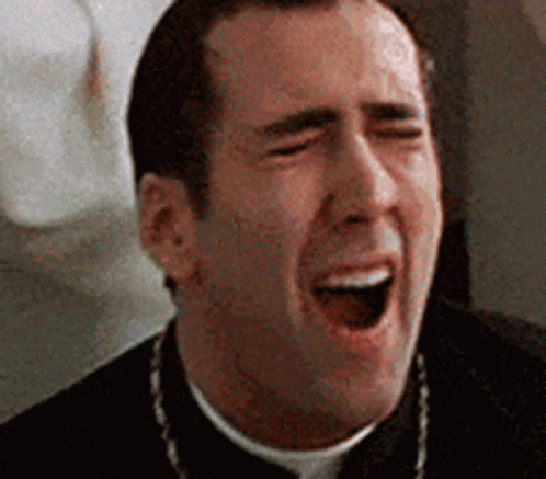 A Priest Is Laughing With His Mouth Wide Open . GIF