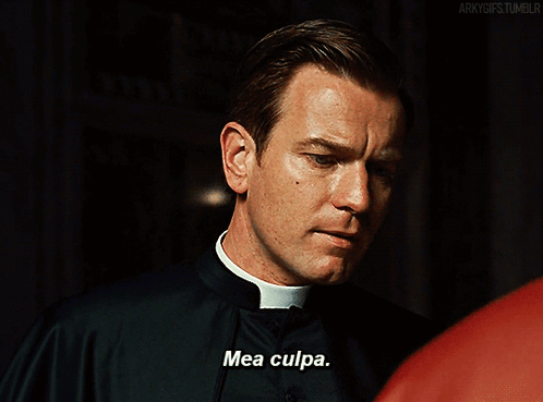 A Priest Says Mea Culpa In Front Of A Red Shirt GIF