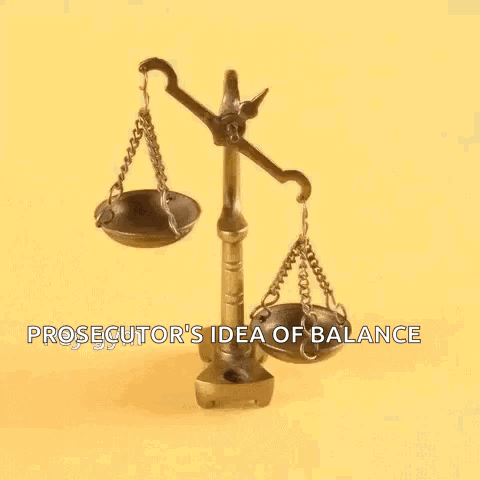 A Prosecutor 'S Idea Of Balance Is Shown With A Person 'S Finger On The Scales . GIF