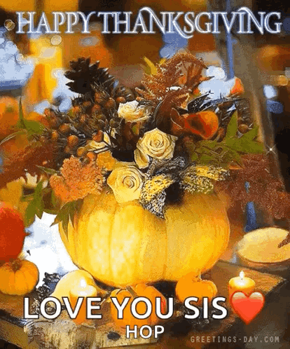 A Pumpkin Filled With Flowers And Candles On A Table . GIF