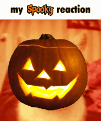 A Pumpkin With A Face Carved Into It And The Words " My Spooky Reaction " Below It GIF