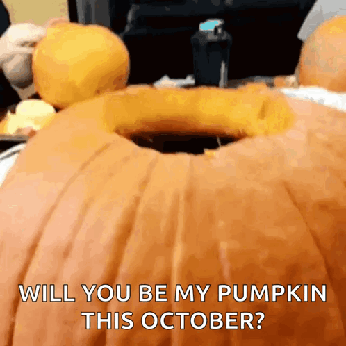 A Pumpkin With A Hole In It And The Words Will You Be My Pumpkin This October Written On It GIF