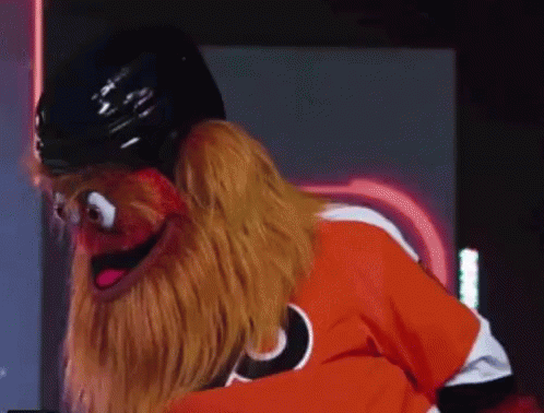 A Puppet Is Wearing A Hockey Helmet And A Flyers Jersey GIF