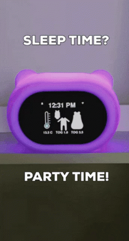 A Purple Alarm Clock Shows The Time As 12:31 Pm GIF