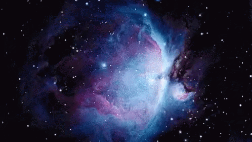 A Purple And Blue Galaxy With Lots Of Stars In It GIF