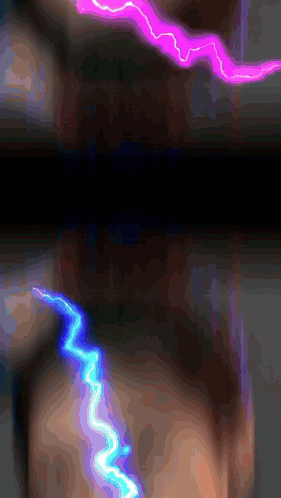 a purple and blue lightning strike on a dark background
