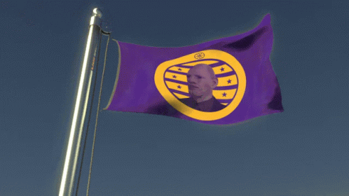 A Purple And Yellow Flag With A Picture Of A Man In The Middle GIF