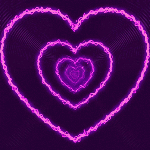 A Purple Background With A Glowing Pink Heart In The Middle GIF