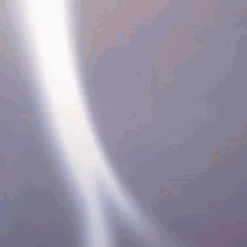 A Purple Background With A White Light Coming Out Of The Corner GIF