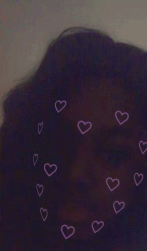 A Purple Background With Pink Hearts Around A Person 'S Head GIF
