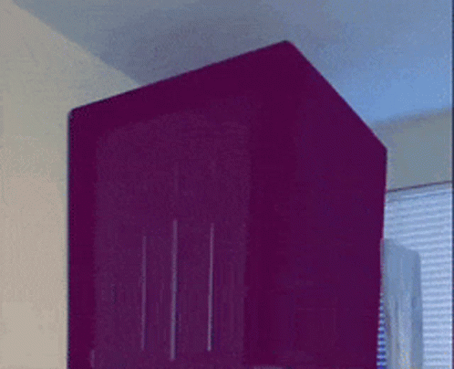 A Purple Box With A Blue Light On The Top Of It GIF