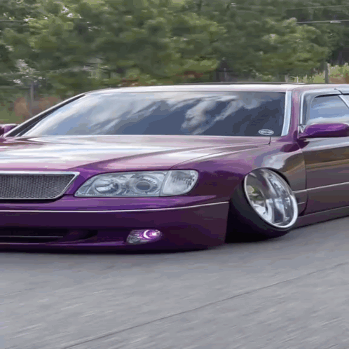 A Purple Car With A Sticker On The Windshield That Says " Always " GIF