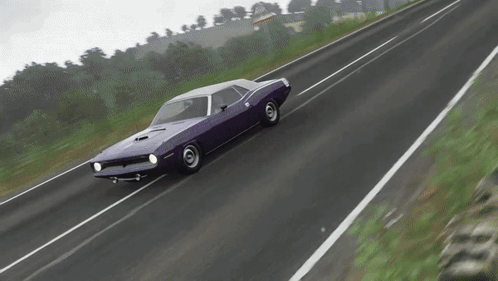 A Purple Dodge Challenger Is Driving Down The Road GIF