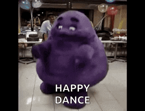 A Purple Monster Is Dancing In A Room With The Words Happy Dance Below It GIF