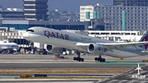 A Qatar Airlines Plane Is On The Runway GIF
