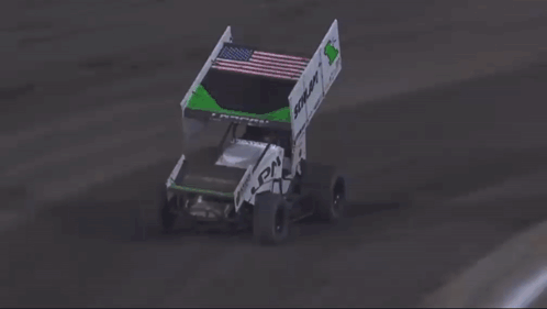 A Race Car Is Crashing Into A Fence And Flying Through The Air . GIF