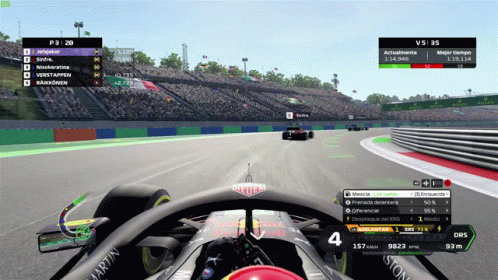 A Race Car Is Driving Down A Track With A Martin Logo On The Side GIF