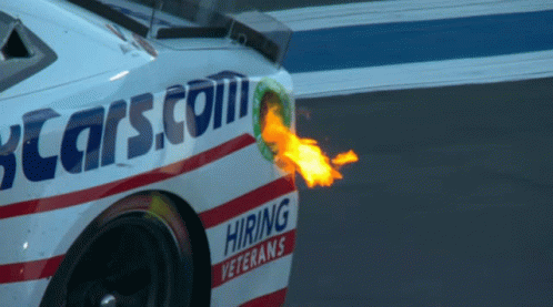A Race Car With A Flame Coming Out Of The Exhaust Pipe That Says Hiring Veterans GIF