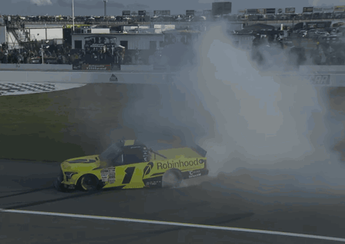A Race Car With The Number 1 On It Is Smoking GIF
