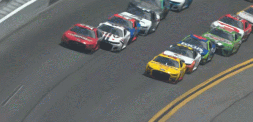 A Race Car With The Number 14 On It GIF