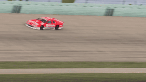 A Race Car With The Number 15 On It GIF