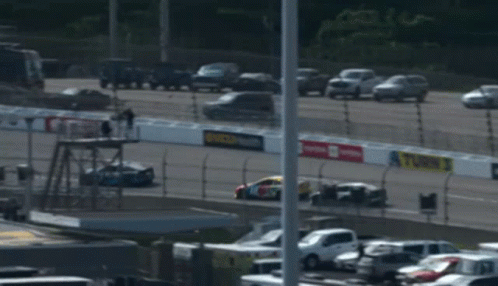 A Race Car With The Number 18 On The Front GIF