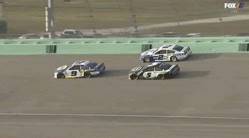 A Race Car With The Number 5 On It GIF