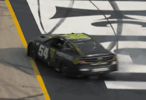 A Race Car With The Number 54 On The Side Of It GIF