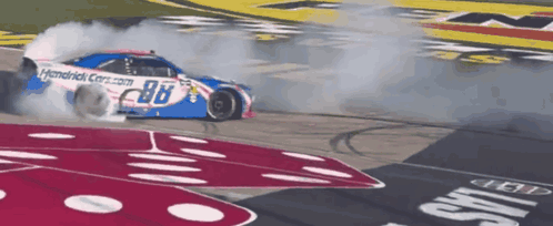 A Race Car With The Number 98 On The Side Of It GIF