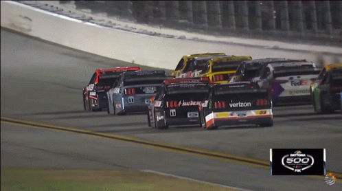 A Race Car With The Word Verizon On The Side GIF