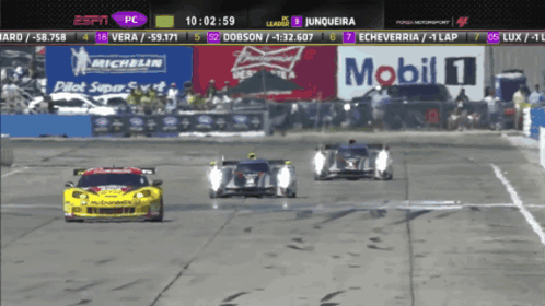 A Race Is Being Shown On Espn With A Banner For Mobil 1 In The Background GIF