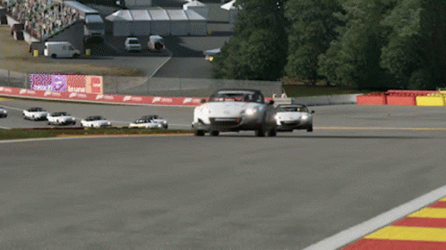 A Race Track With A Lot Of Cars And A Sign That Says ' Acura ' On It GIF
