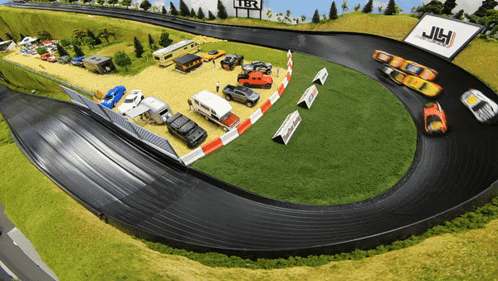 A Race Track With A Sign That Says Jlh GIF