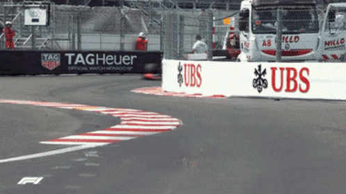 A Race Track With A Sign That Says Tag Heuer On It GIF