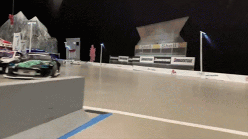 A Race Track With Shell And Bridgestone Signs On It GIF
