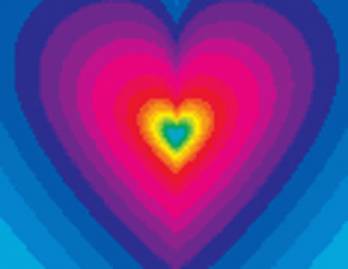 A Rainbow Colored Heart With A Pink Heart In The Middle GIF