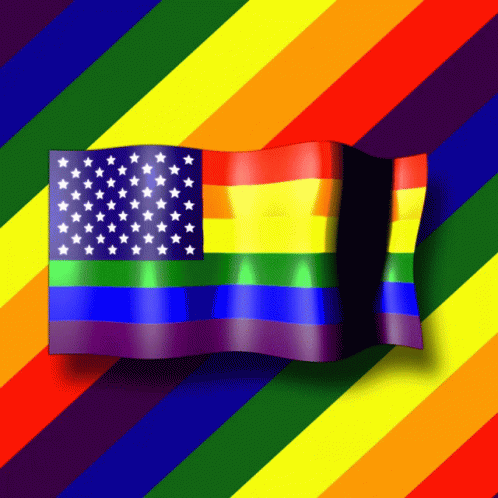 A Rainbow Flag With White Stars On It Is Waving In The Wind GIF