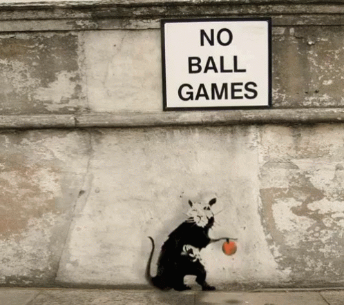 A Rat Is Holding A Ball Under A No Ball Games Sign GIF