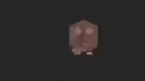 A Rat With A Long Tail Is Walking On A Black Surface . GIF