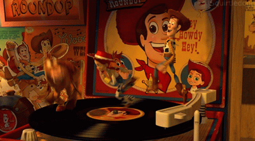 A Record Player With Woody And Buzz Lightyear Playing Roundup GIF