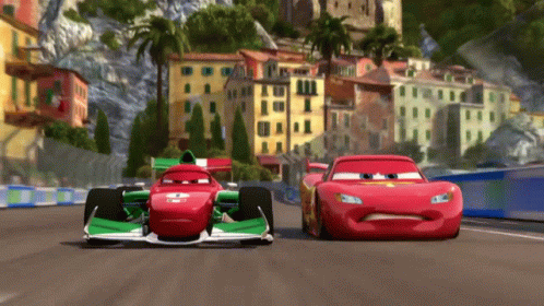 A Red And Green Race Car With The Number 4 On The Front GIF